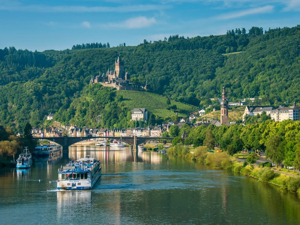 River cruise ship passing Cochem on the Moselle in Germany